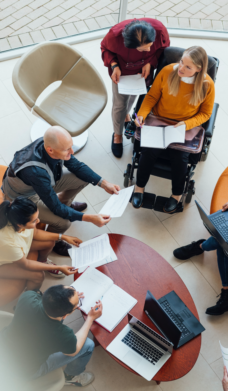sharing notes and discussing among teams