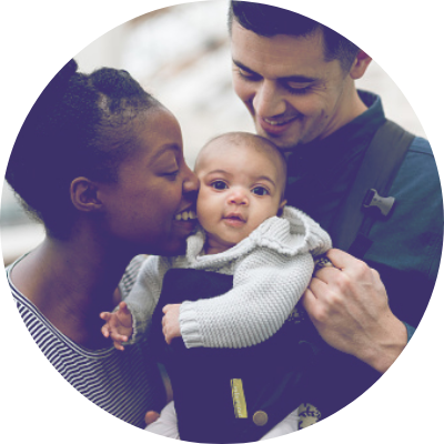 Mother and father holding baby